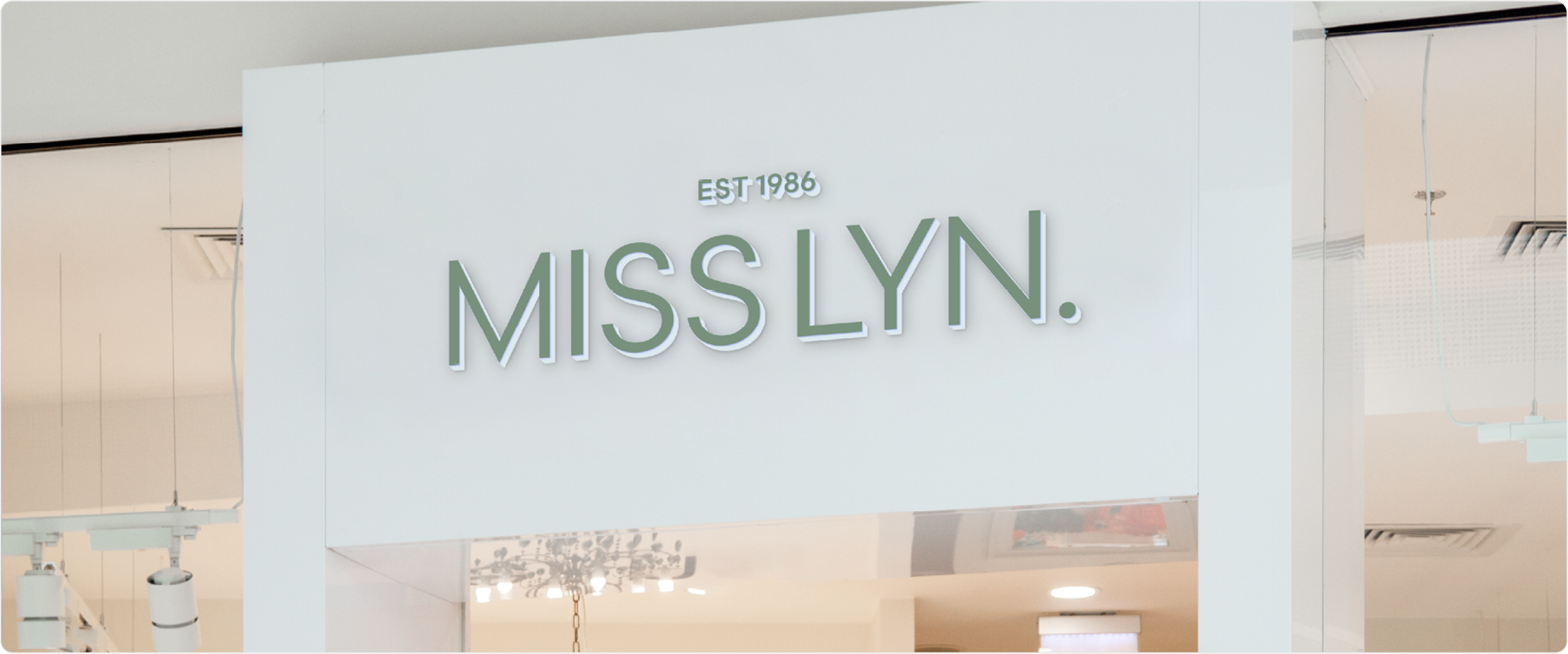 Visual mockup of the rebranded logo applied to a retail shop, showcasing the updated brand identity.