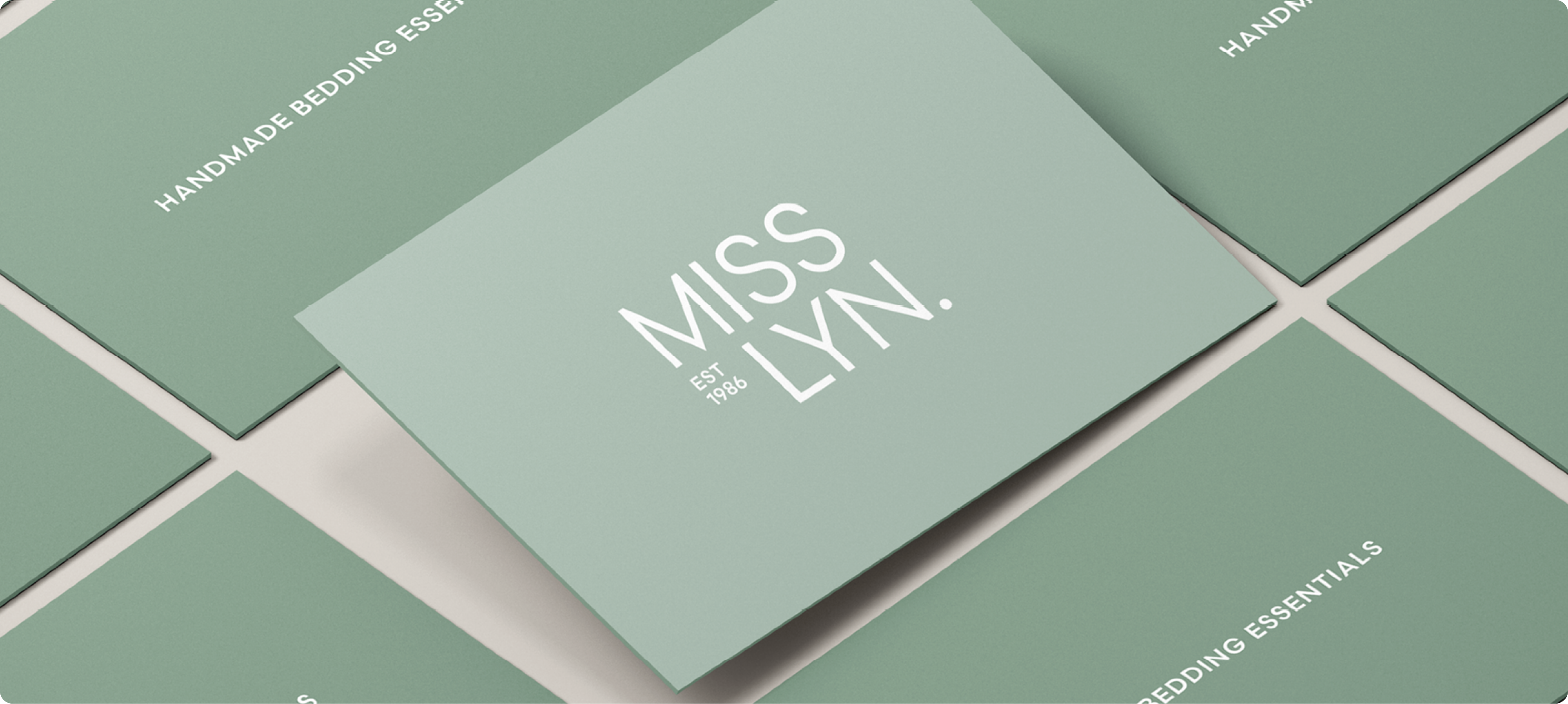 Newly designed business cards showcasing the refreshed brand identity after rebranding.